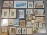 a lot of framed pictures on the wall of a room