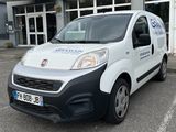 a white van that is parked in front of a building