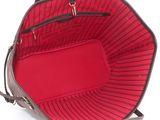 the inside of a red and black purse with a red lining
