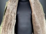 a mannequin with a fur coat on a black mannequin