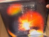 someone is holding a cd in a box with a picture on it