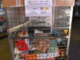 a shopping cart with many items in it in a warehouse