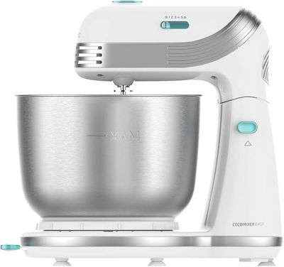 a close up of a mixer on a stand with a bowl