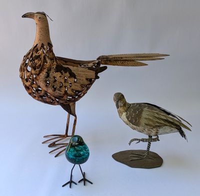 two birds that are standing next to each other