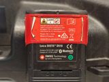 a close up of a red and black device on a table
