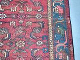 rug on the floor is red and blue with a pattern on it