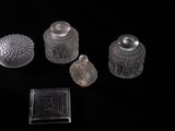 a lot of glass objects that are on a table