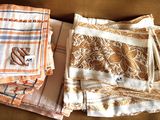 several pieces of cloth sitting on top of a couch next to each other