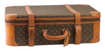 LOUIS VUITTON. Valise en cuir avec monogramme, poignée en cu…