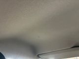 the interior of a car with the sunroof down on the ceiling