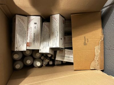 a cardboard box filled with batteries and a box of batteries