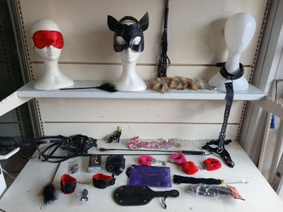 several mannequin heads are sitting on top of a white table