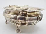 a silver bowl that is sitting on a table