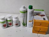 a bottle of aloe vera and several bottles of aloe vera