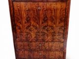 an image of a wooden chest of drawers with a marble top