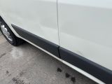 a white van parked on the side of the road