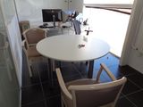 a table and chairs in a room with a glass door