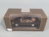 the toy car is in the box on the table