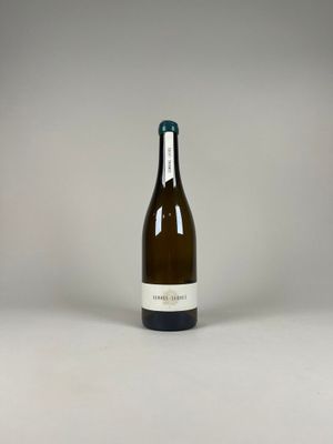 a bottle of wine that is sitting on a table