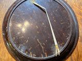 a wooden table with a clock on it on it