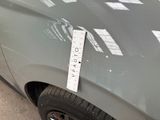 a sticker on the hood of a car that has a sticker on it