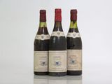 three bottles of wine sitting next to each other on a table
