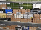 many boxes that are sitting behind a metal fence