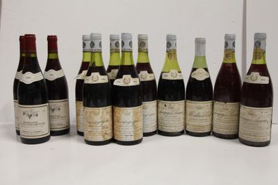 several bottles of wine are lined up in a row on a table