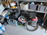 a room with a lot of tools and a lot of bins