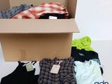 a box full of clothes that is sitting on a table