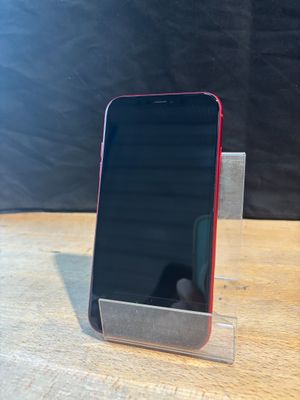 a cell phone that is sitting on a stand on a table