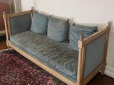 an image of a living room with a couch and a rug