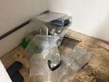 a picture of a bathroom with a toilet and a trash can on the floor