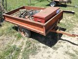 a small trailer that is sitting in the grass