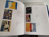 an open book with a picture of a woman on it