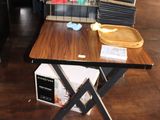 a wooden table with a microwave on top of it