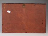 a brown suitcase with a tag on it sitting on a table