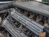 a close up of a car ' s engine in the back of a truck