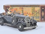 a toy car with a dog in the back of it