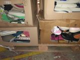 two boxes that have shoes in them on the floor