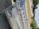 a trailer that has a gate on the back of it