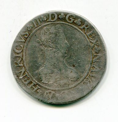 une vieille pièce d'argent sur laquelle figure l'effigie d'un homme