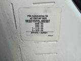 a close up of a white vehicle with a sticker on it ' s side