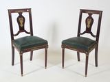 pair of antique mahogany chairs with green upholstered leather seats