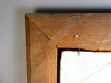 a close up of a picture of a wooden frame