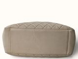 beige leather seat cover for a car with a quilted design