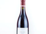 a bottle of wine that is sitting on a table