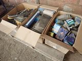 two boxes of items that are sitting on a pallet