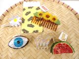a lot of hair accessories that are sitting on a table