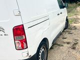 a white van that is parked on the side of the road